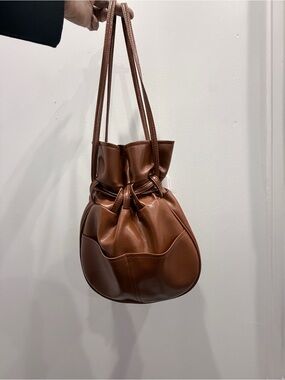 Vinyl Drawstring Shoulder Bag in Chestnut Brown-